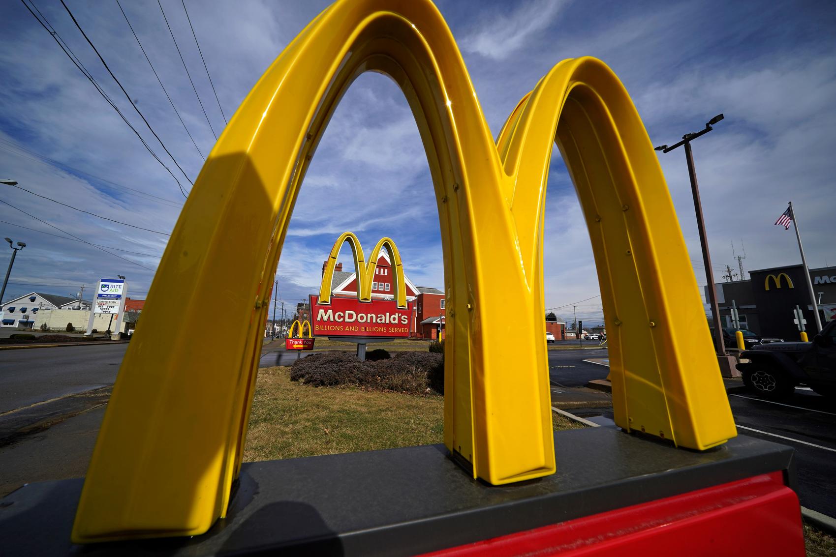 McDonald's boosts third quarter sales by emphasizing value but warns customers remain pressured